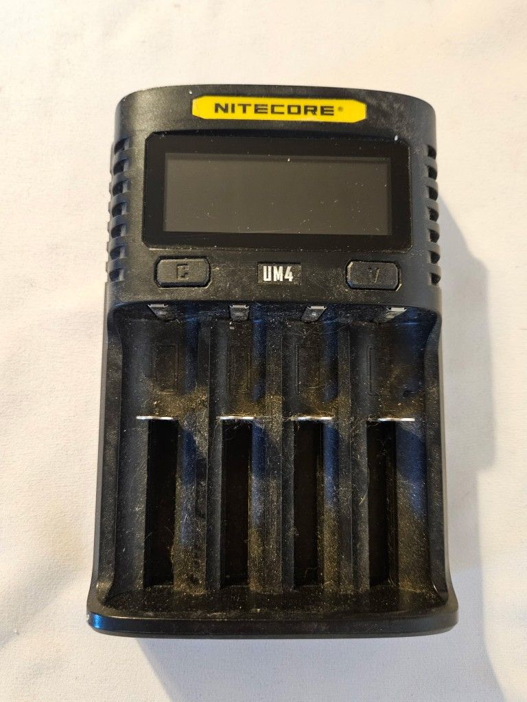 Nitecore UMS4 Intelligent USB Four-Slot Superb Battery Charger No Cord It is a smart charger that can charge up to four batteries simultaneously and i
