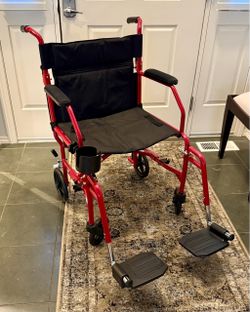 Medline Ultra Lightweight Transport Wheelchair (MDS808200F3R) for Adults, Foldable, 19-Inch Seat Width, Red Frame, Black Upholstery