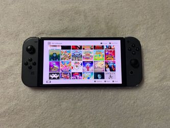 Nintendo Switch OLED + 125 SWITCH GAMES and 7500 Retro Games