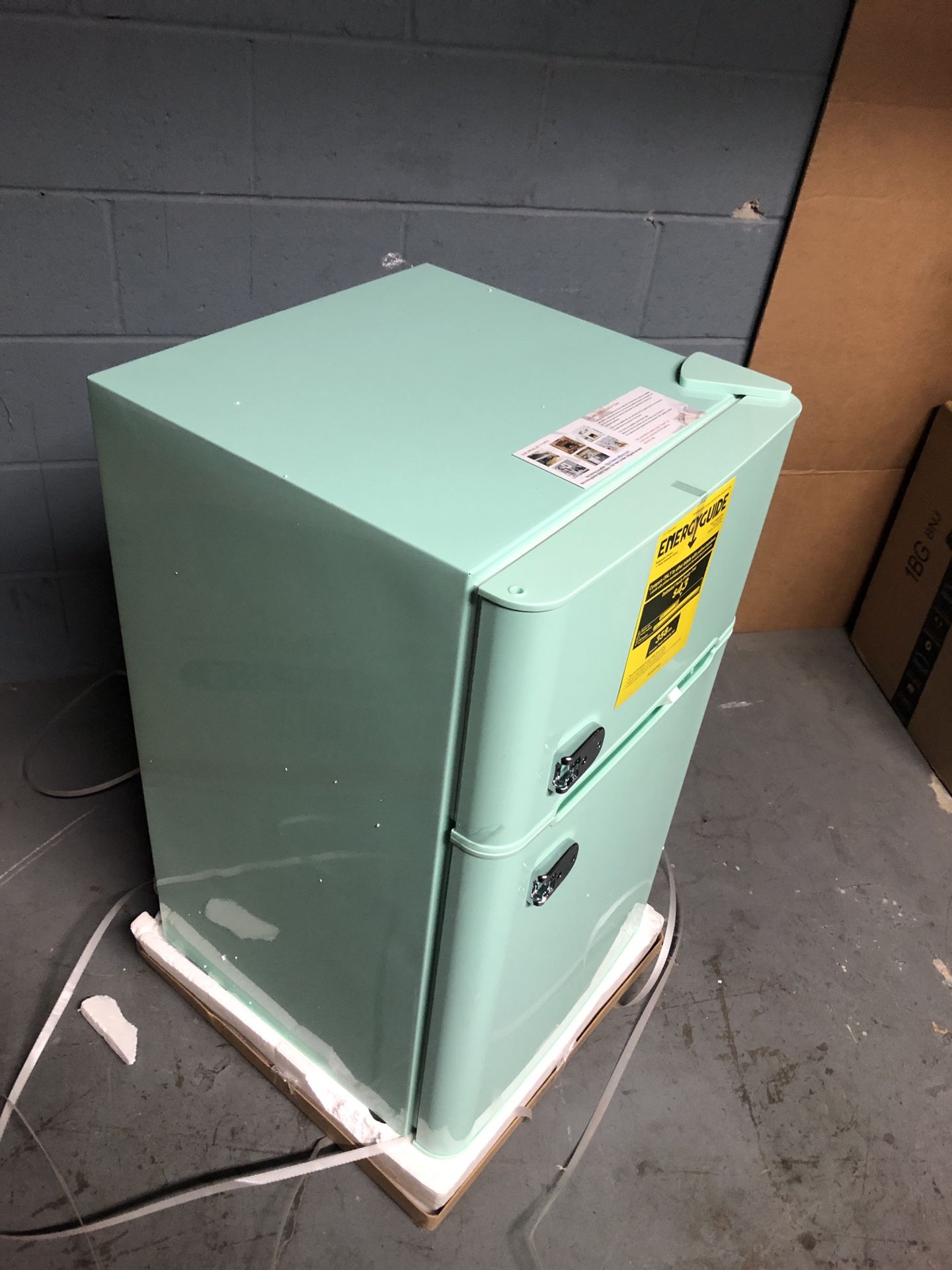 Compact Mini Refrigerator with Separate Freezer in the box with small dent on one side