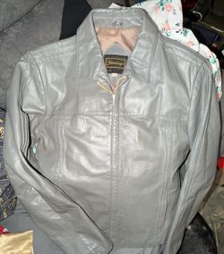 vintage gray mens size 40 leather jacket by Flamingo, as Based on its style-featuring a structured collar, zippered front, and a characteristic 80s/90