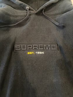 Supreme "EST. 1994" Embossed Logo Hooded Sweatshirt in Black.