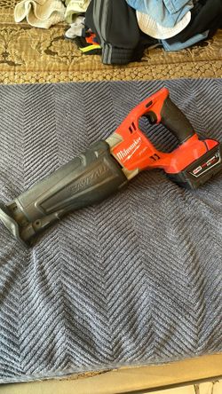 Milwaukee Fuel Saw And 5.0 Battery