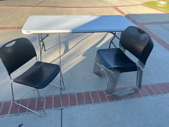 Black stackable chairs & foldable utility tables