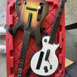 Wii Guitar hero 2 guitars and 2 games- hero lll and world tour