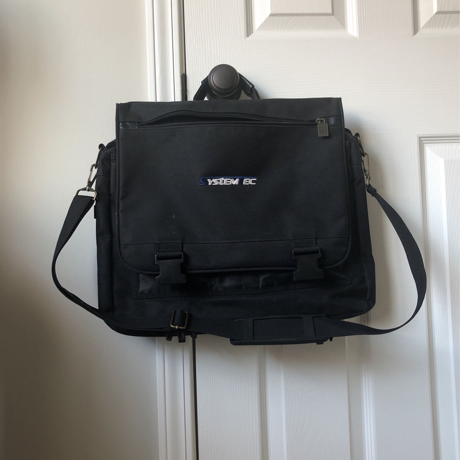 Black Satchel With Adjustable Strap And Buckles
