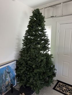 FREE 9’ Pre-lighted Artificial Christmas Tree