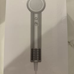 Hair dryer with magnetic diffuser for curly hair.