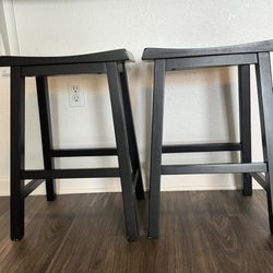 Two black counter stools