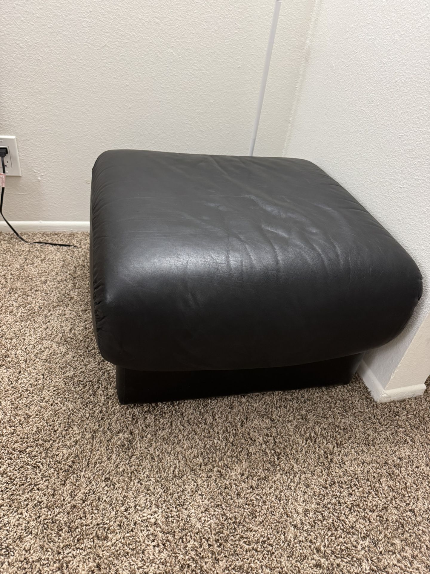 Soft ottoman on wheels.