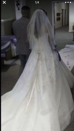 Selling my wedding dress asking $1,000 the value of this dress is 2 thousand and 100 hundred size 5