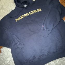 navy blue Champion Notre Dame Fighting Irish hoodie sweatshirt with yellow lettering Large on tag
