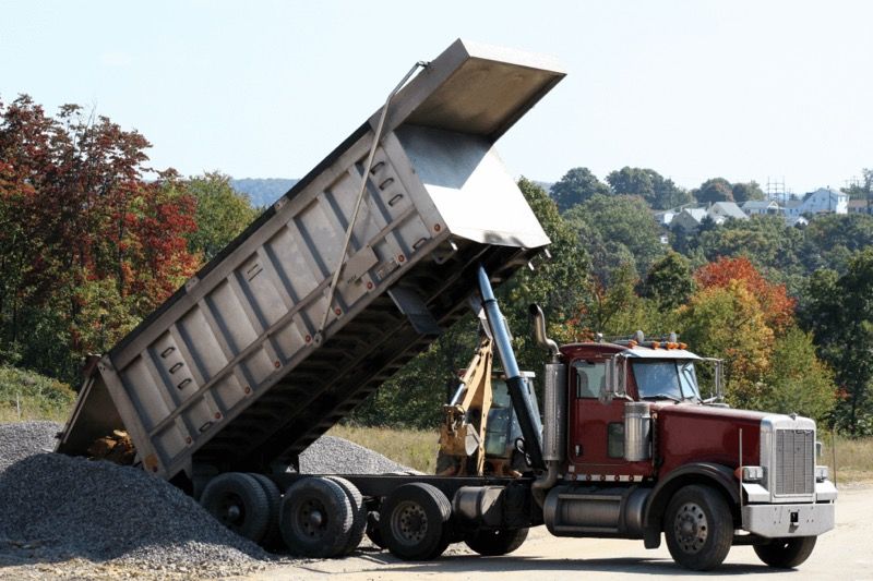 Chofer de camión de volteo (dump truck)