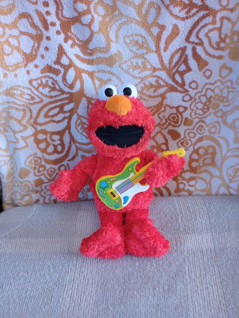 Sesame Street Rock and Rhyme Elmo Talking, Singing 14-Inch Plush Toy for Toddler