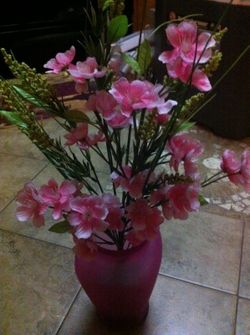 Unique pink vase with flowers