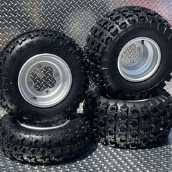 Honda Suzuki Kawasaki  Stock Oem did Honda wheels with 21x7-10 and 20x11-9 6 ply boss racing tires bolt pattern 4-110 rear and 4-144 front $