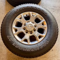 18” RAM 2500/3500 OEM Polished Wheels & Firestone Transforce A/T Tires — Set of 4