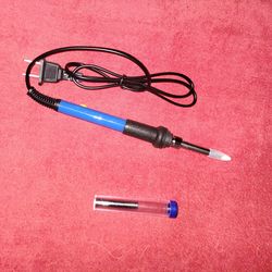 Soldering iron and solder