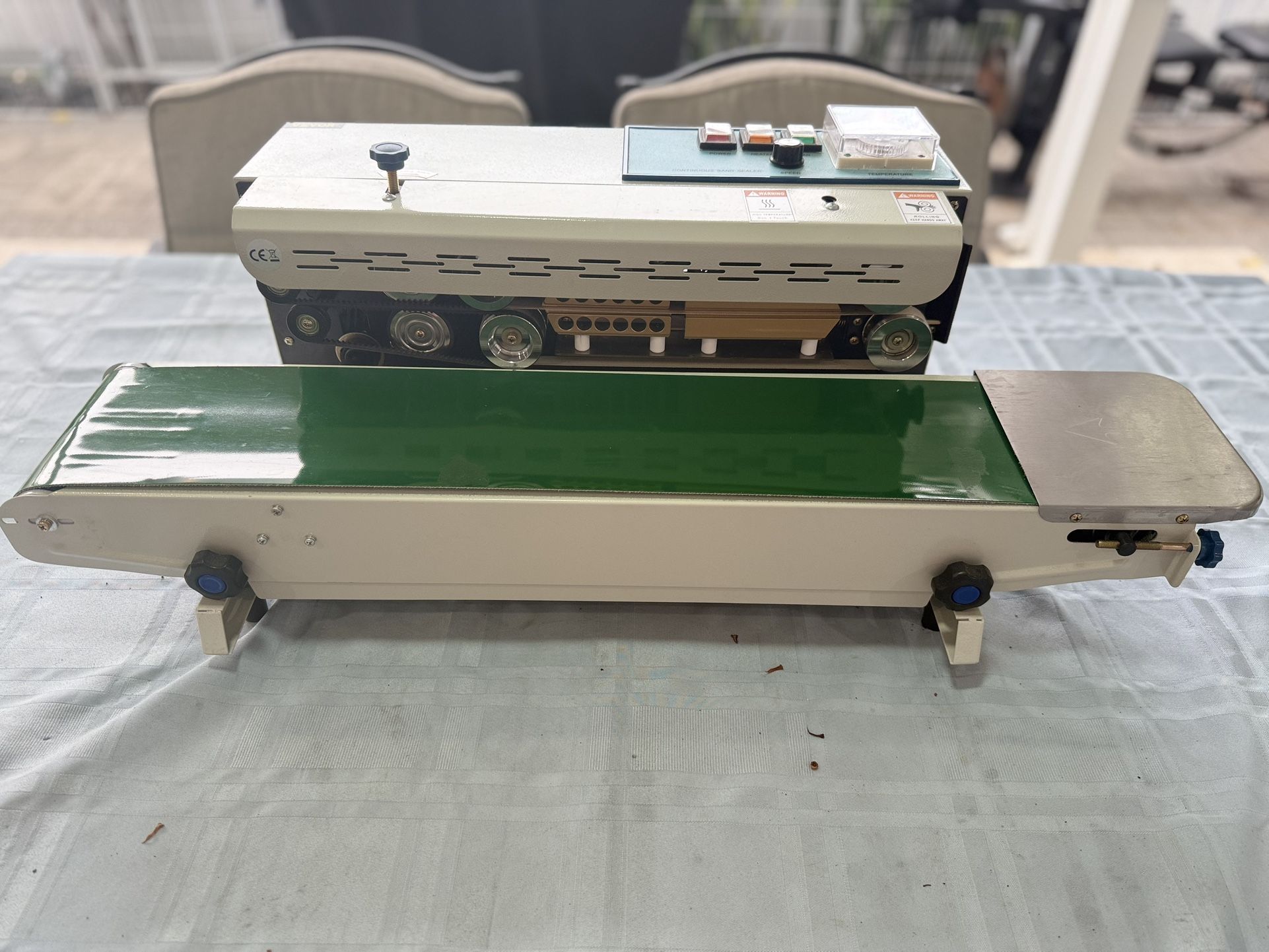 Sellador continuo horizontal automático de la banda del sellador FR900 de la bolsa de plástico de la máquina de sellado continuo 110V