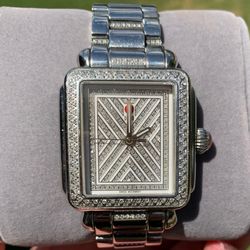 Michele Deco limited edition, diamond watch and diamond band. This elegant timepiece features a sleek silver design, perfect for any occasion. Experie