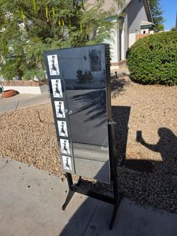 Large Mirror with hidden doors that open to store items