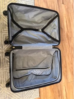 Suitcase on wheels with handles