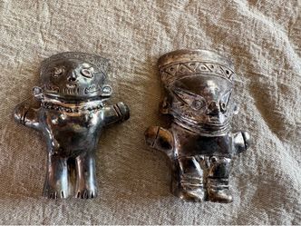 Male and Female silver Mexican god figures