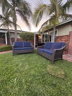 sturdy modern comfortable in great condition Outdoor Wicker Loveseat Set of 2 navy blue Nautica pillow covers sturdy modern comfortable in great condi