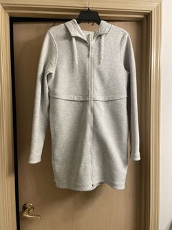 Like New Lululemon size small light gray long jacket. Zip up front and side zippers with hood.