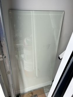 Clear table glass with beveled edge.