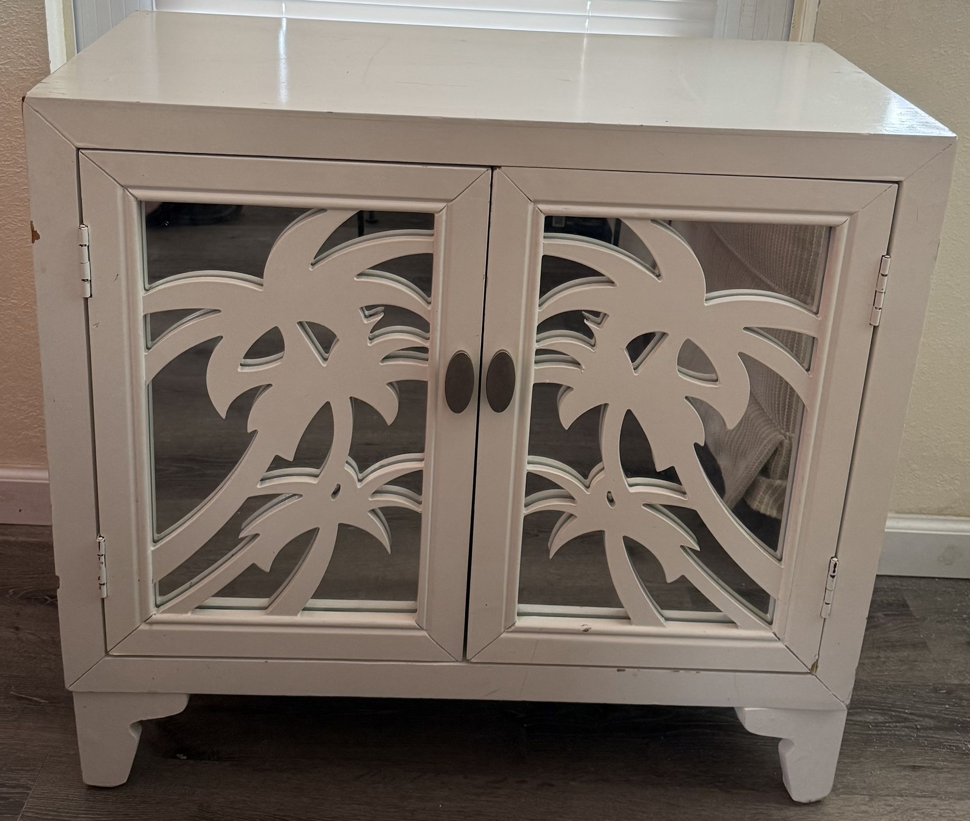 Coast to Coast 2 Door Cabinet With Palm Tree Cutout