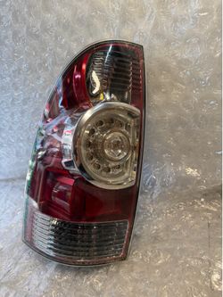 2005-2015 Toyota Tacoma Left Driver Side Tail Light  OEM