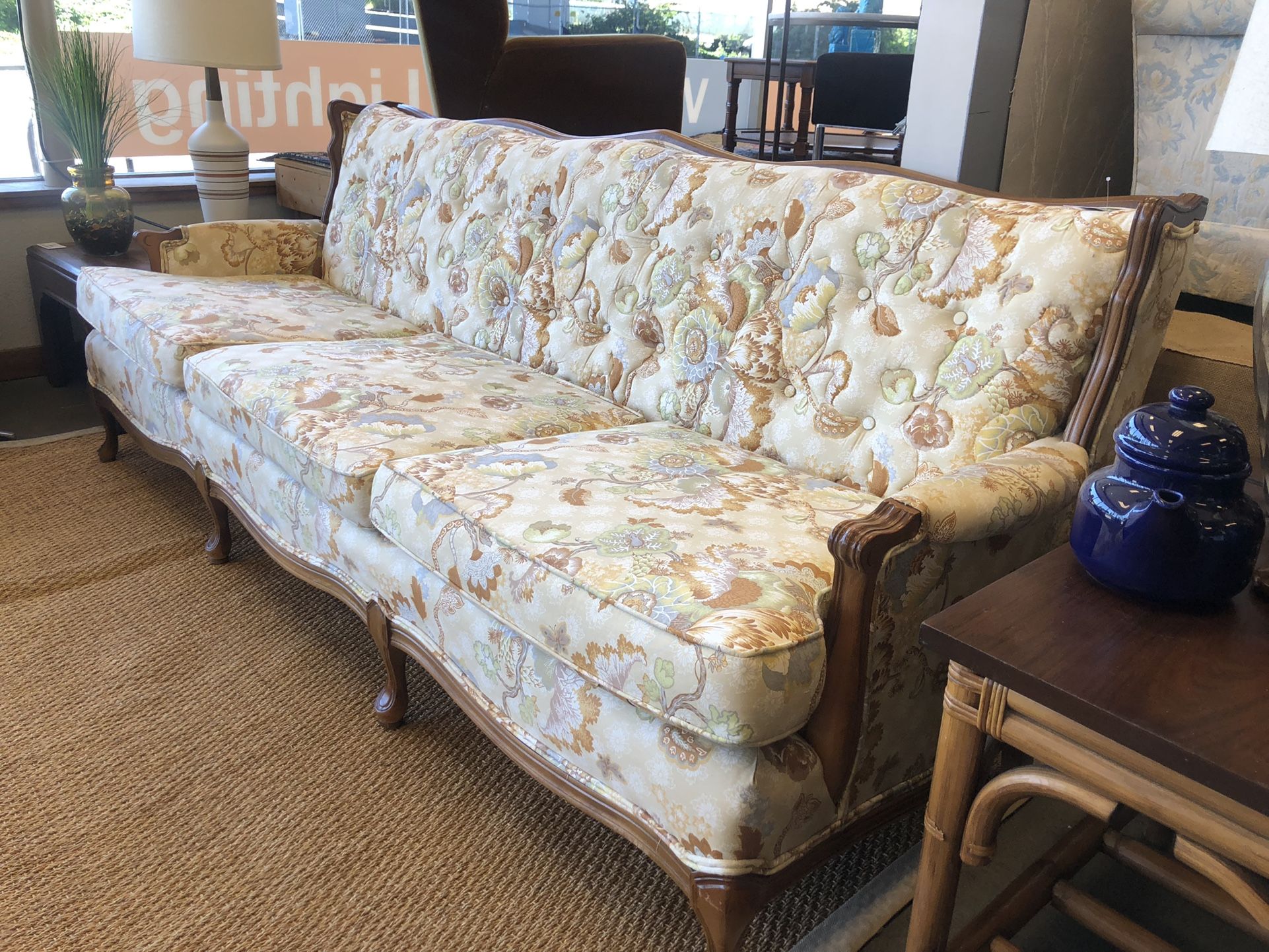 Vintage Wood-Framed Sofa with Muted Floral Upholstery 