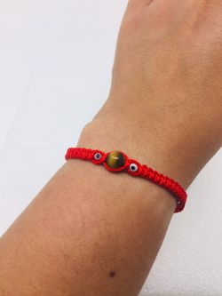 Tiger eye red bracelet protection, good decision,good luck.