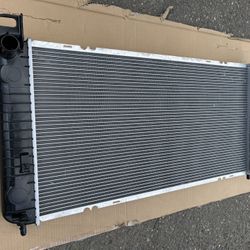 Radiator - 34-1/16" Core Compatible With Chevrolet Silverado, GMC and Cadillac.