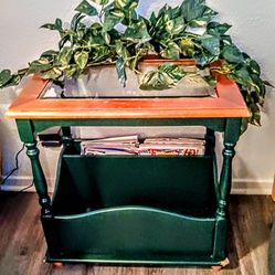 A solid wood in table with bevel glass top no lamp