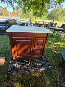 Dark Bathroom Vanity with Sink and Faucet
