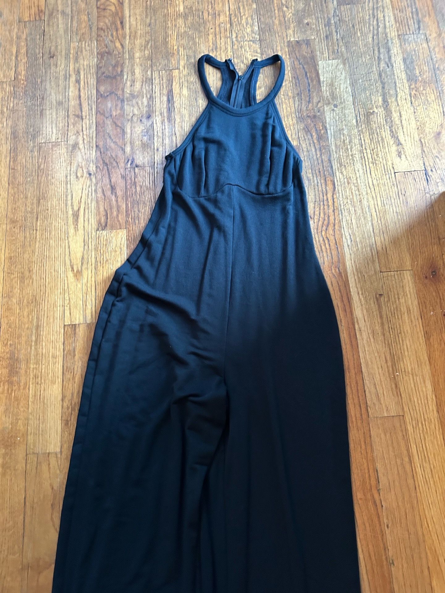 Yitty black jumpsuit with zipper detail and wide leg design. Size: XS