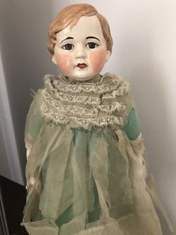 Antique doll. Vintage clothing