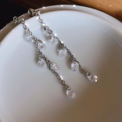 Swarovski crystal on silver earrings.