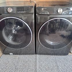 Black frontload Samsung washer and dryer