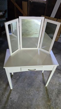 Vanity desk with mirror.
