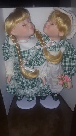 Beautiful sets of porcelean dolls with stand. Very beautiful detailed. $20