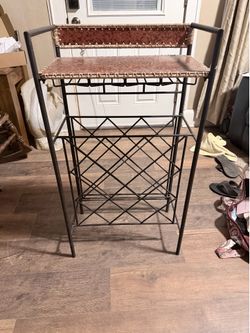 Pier-1 wine holder/server. 910