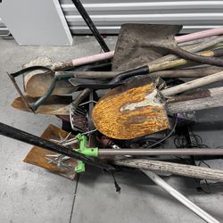 Shovels, spades, hand rakes, and other gardening implements.