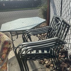5 Chairs/Patio table . 