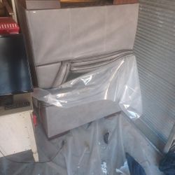 Two Regular size  Gray Leather Sofas 