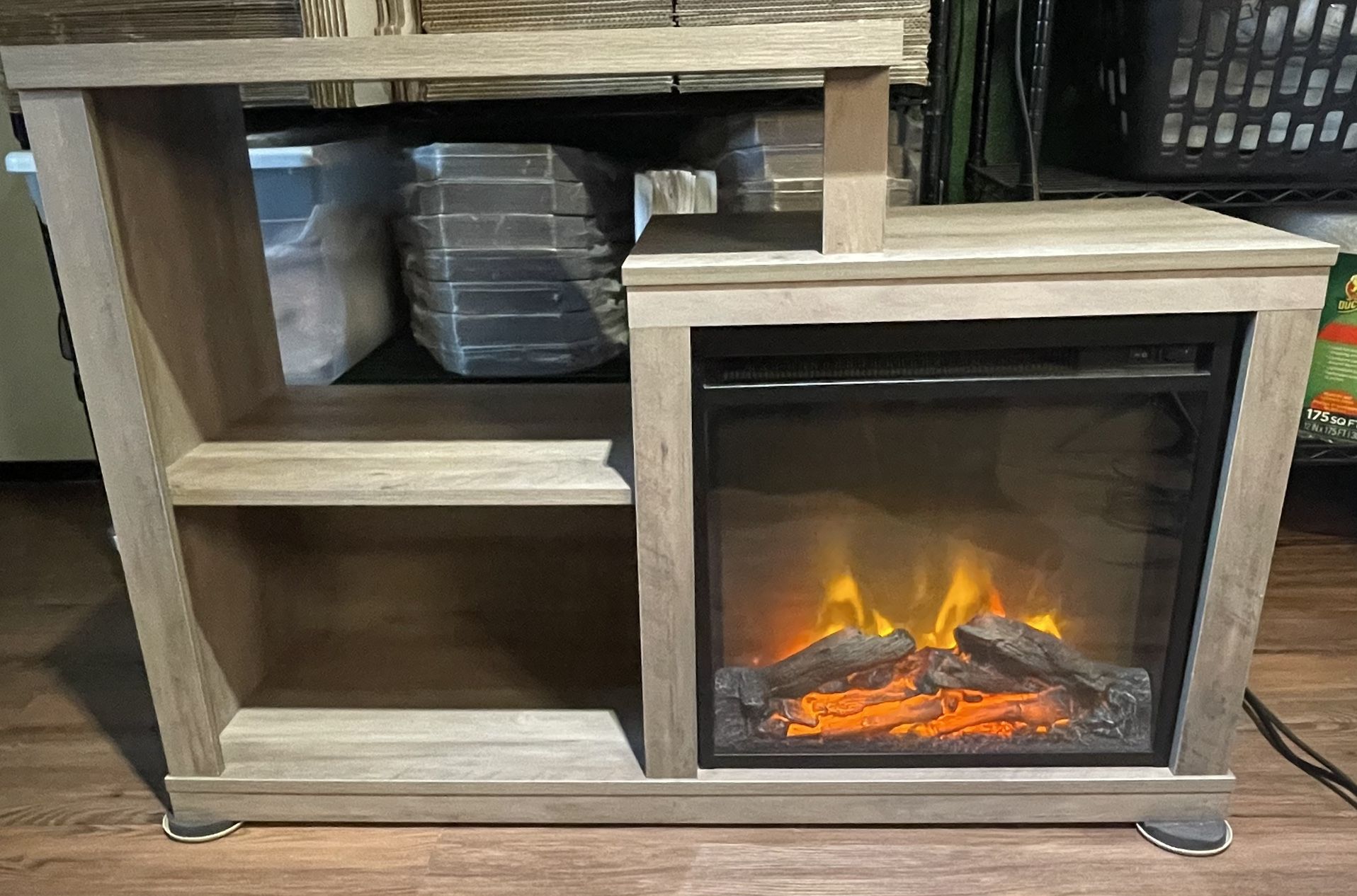 Entertainment Stand with Heated Faux Fireplace .