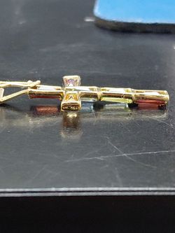 14k gold cross with multi colored stones
