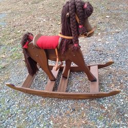 VERY NICE ROCKING.   HORSE. 100. OR BEST OFFER. NEEDS A HOME